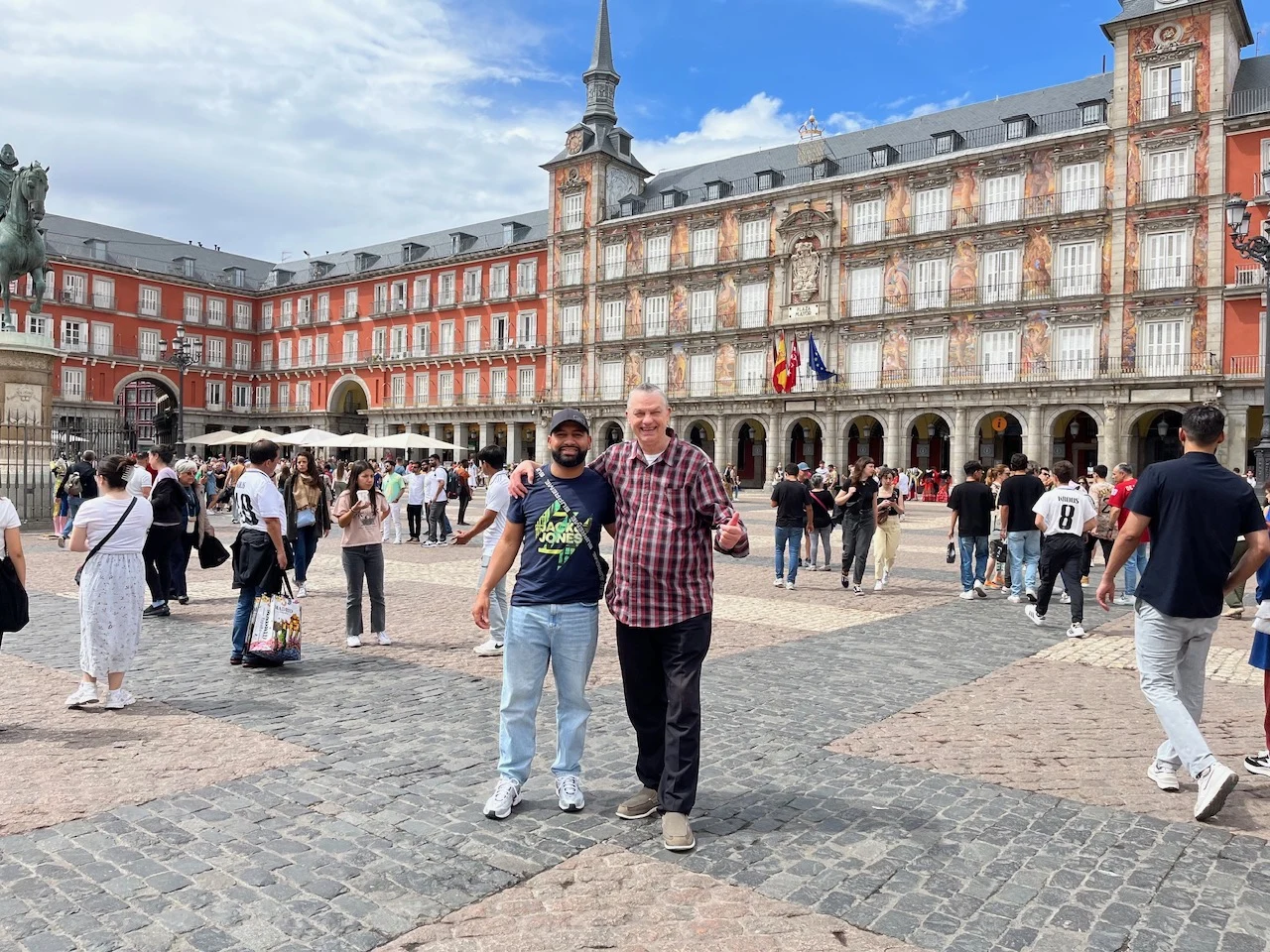 Terry and a friend visiting a square in Madrid