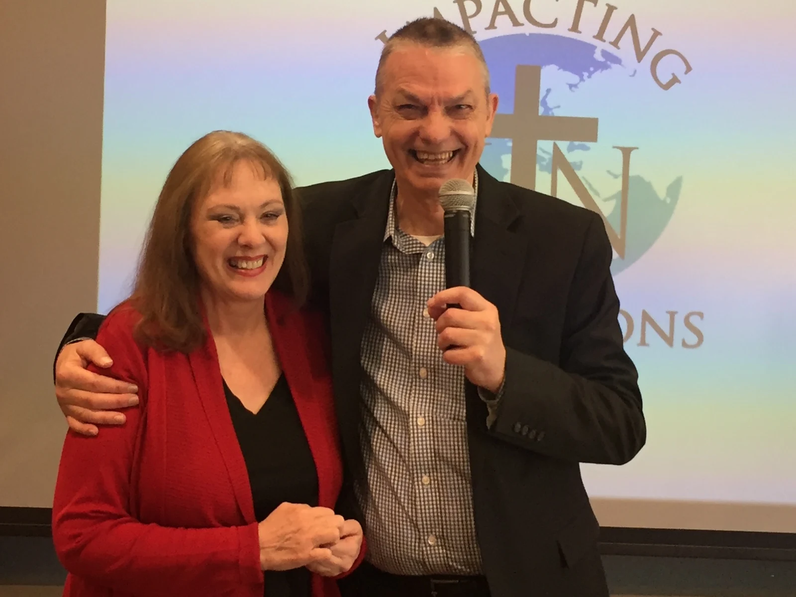 Lynn and Terry Chesbrough smiling together at a ministry gathering
